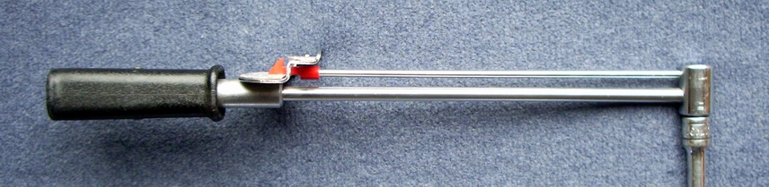 Beam-type torque wrench shown from the side with its indicator bar