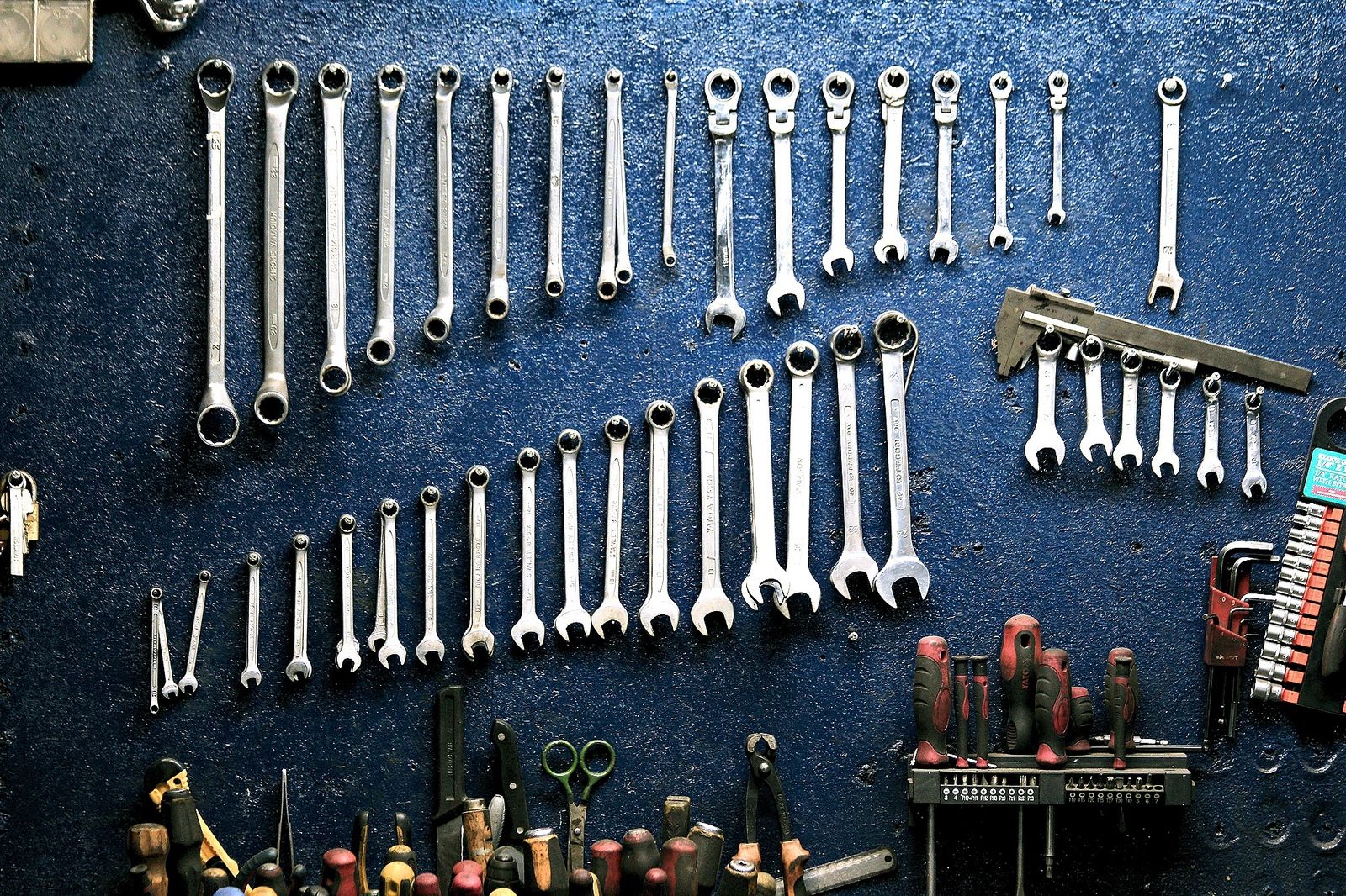 Workbench with mixed hand tools in a home garage
